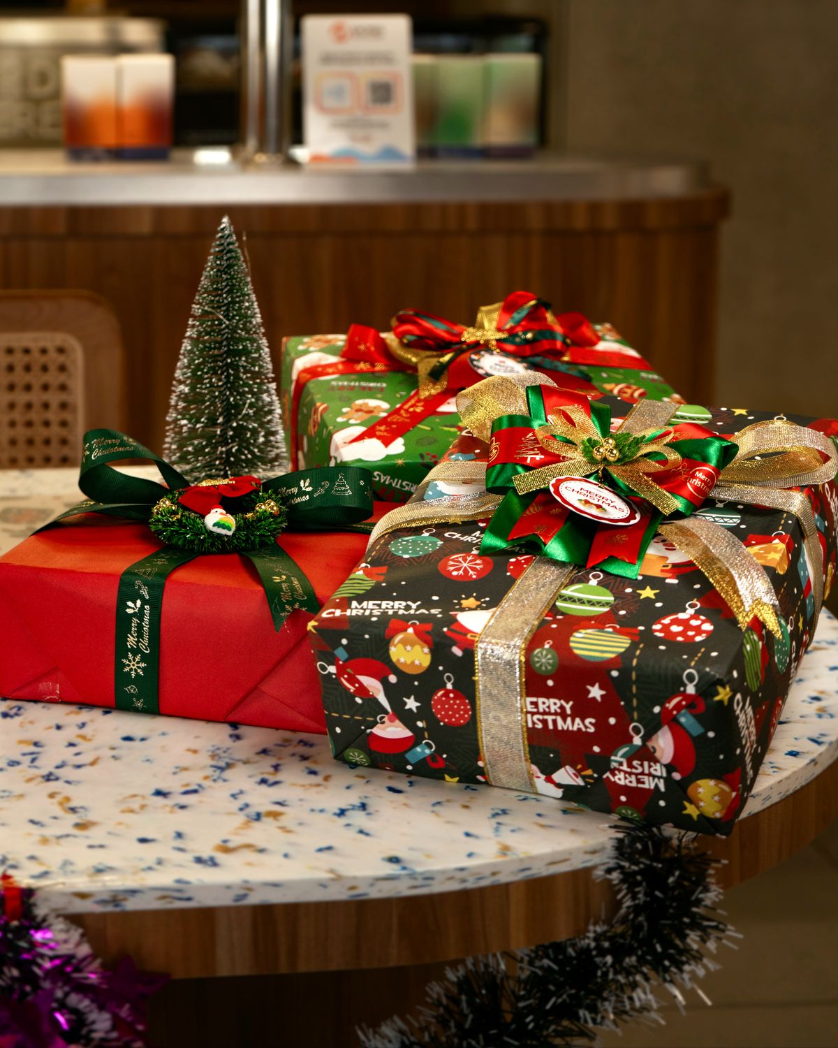 Festive Christmas gifts wrapped with ribbons on a table, perfect for holiday celebration.